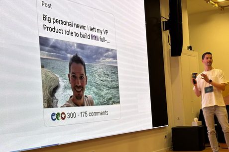 Oded Tsamir presenting on stage next to a projected slide of his own LinkedIn post — &ldquo;Big personal news: I left my VP Product role to build Liftli full-time&rdquo; — showing 300 reactions and 175 comments